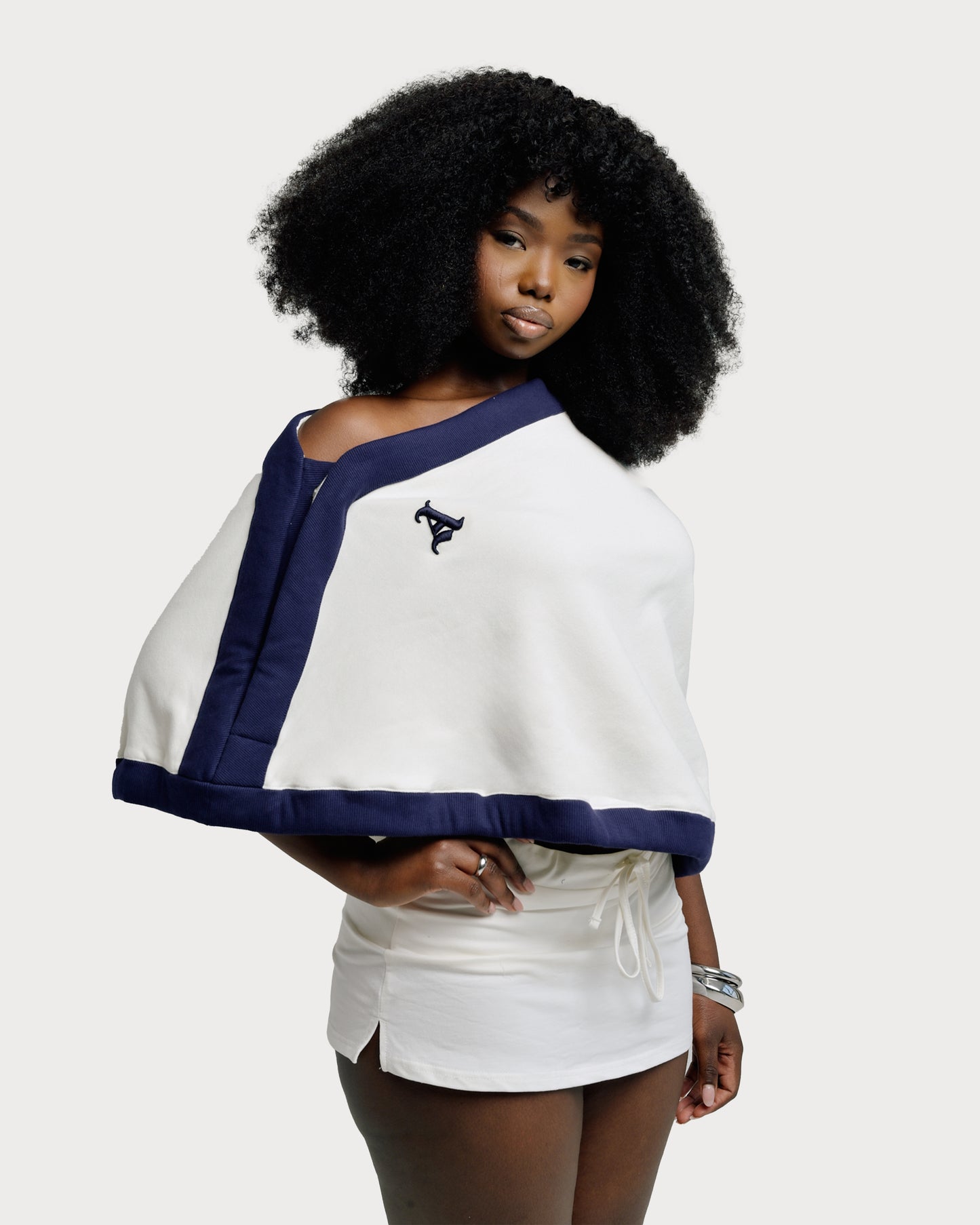 Model is wearing Jolie Draped Sweatshirt Top by Aseye Studio in size S/M.