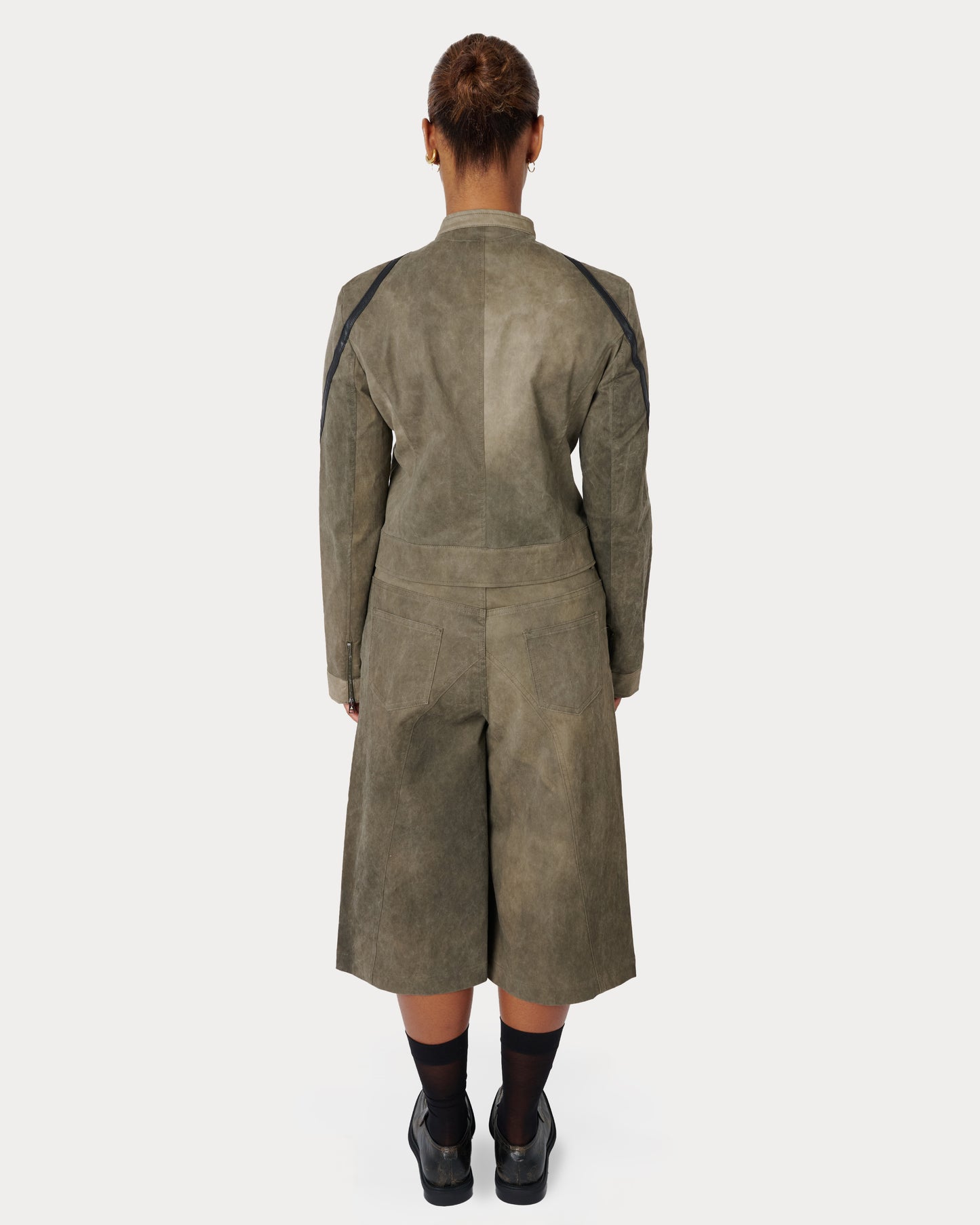 Model is wearing a full Aseye Studio look featuring Suzi Jacket (Size M) and Tommi Shorts (Size L)