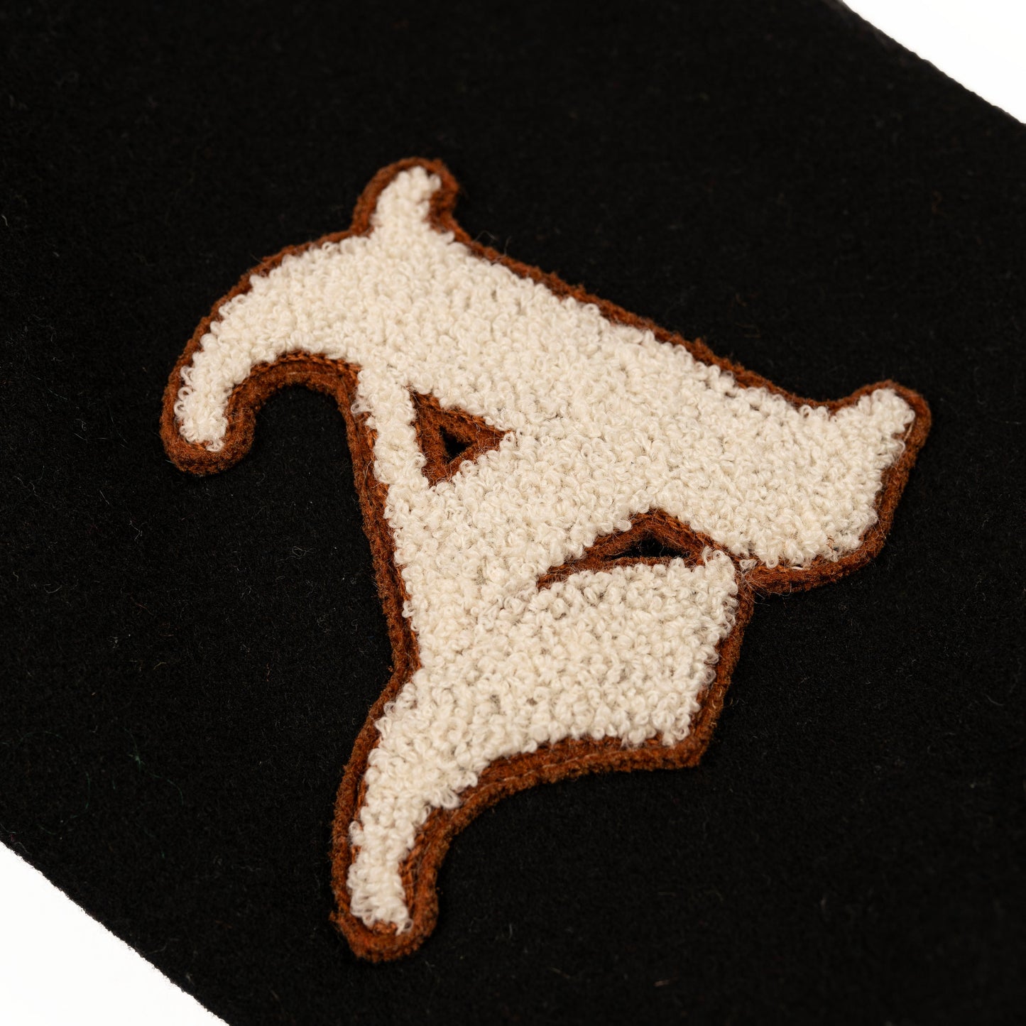 Detail View of Chenille 'A' Logo Letter on Rue Varsity Jacket by Aseye Studio