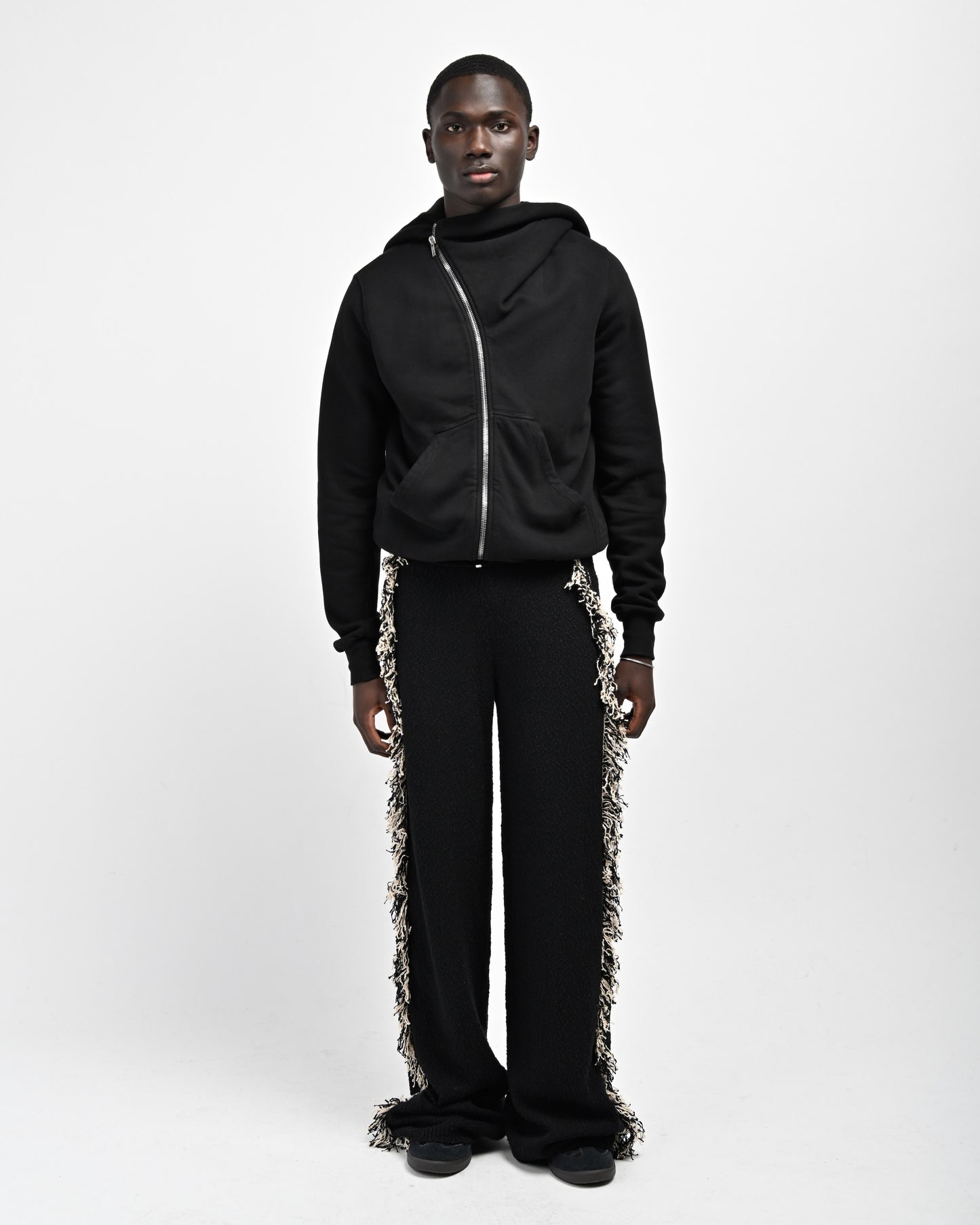 Model is wearing Andy Fringe Knit Pants by Aseye Studio