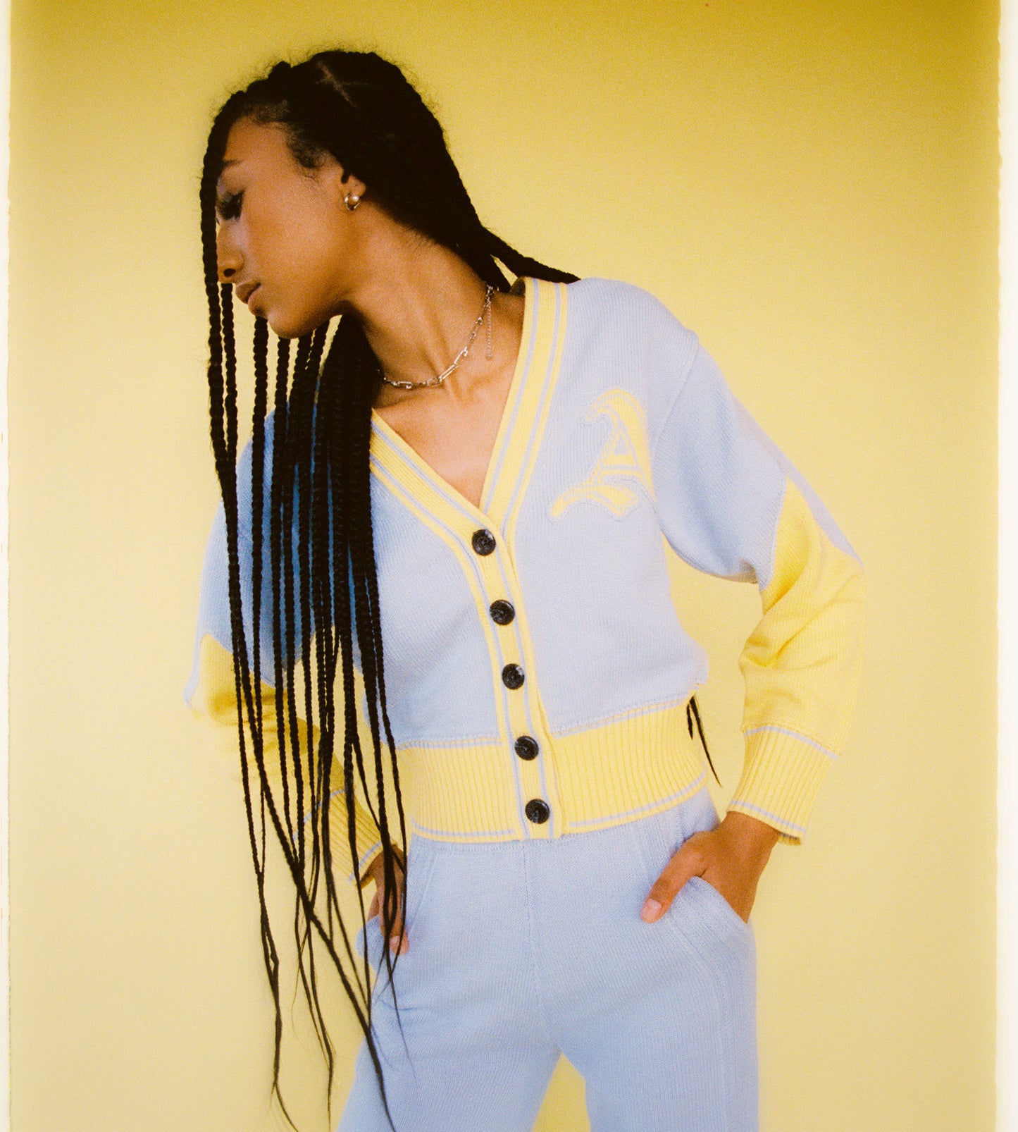 Model is wearing the Byrd Classic Knit Cardigan in Icy Blue and Butter Yellow. Pair with Byrd Classic Knit Pants for full matching look by Aseye Studio.