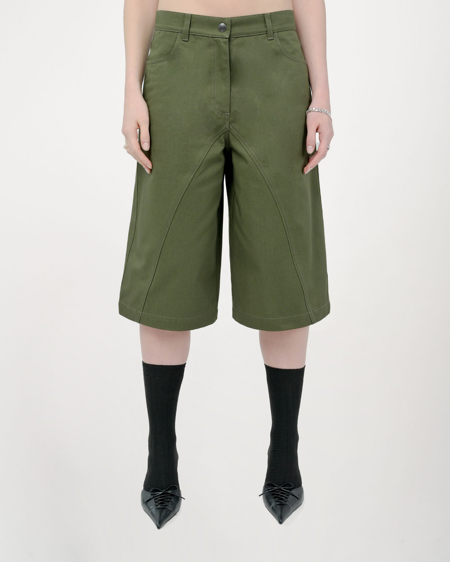 Model is wearing size Small in the Tommi Short in Olive Green by Aseye Studio
