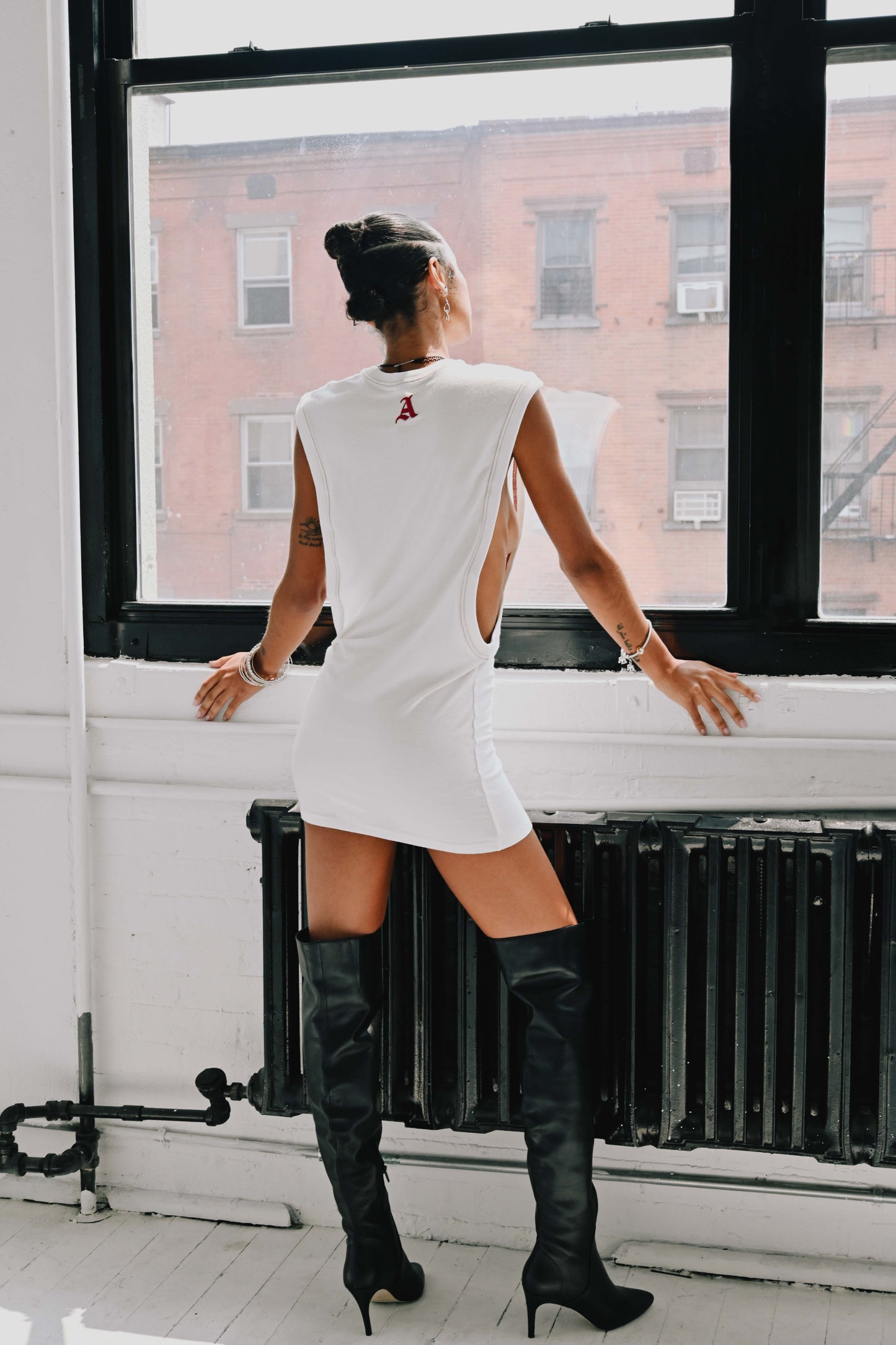 Model is wearing Size Small in Amerie French Terry T-shirt Dress. white T-shirt Dress by Aseye Studio