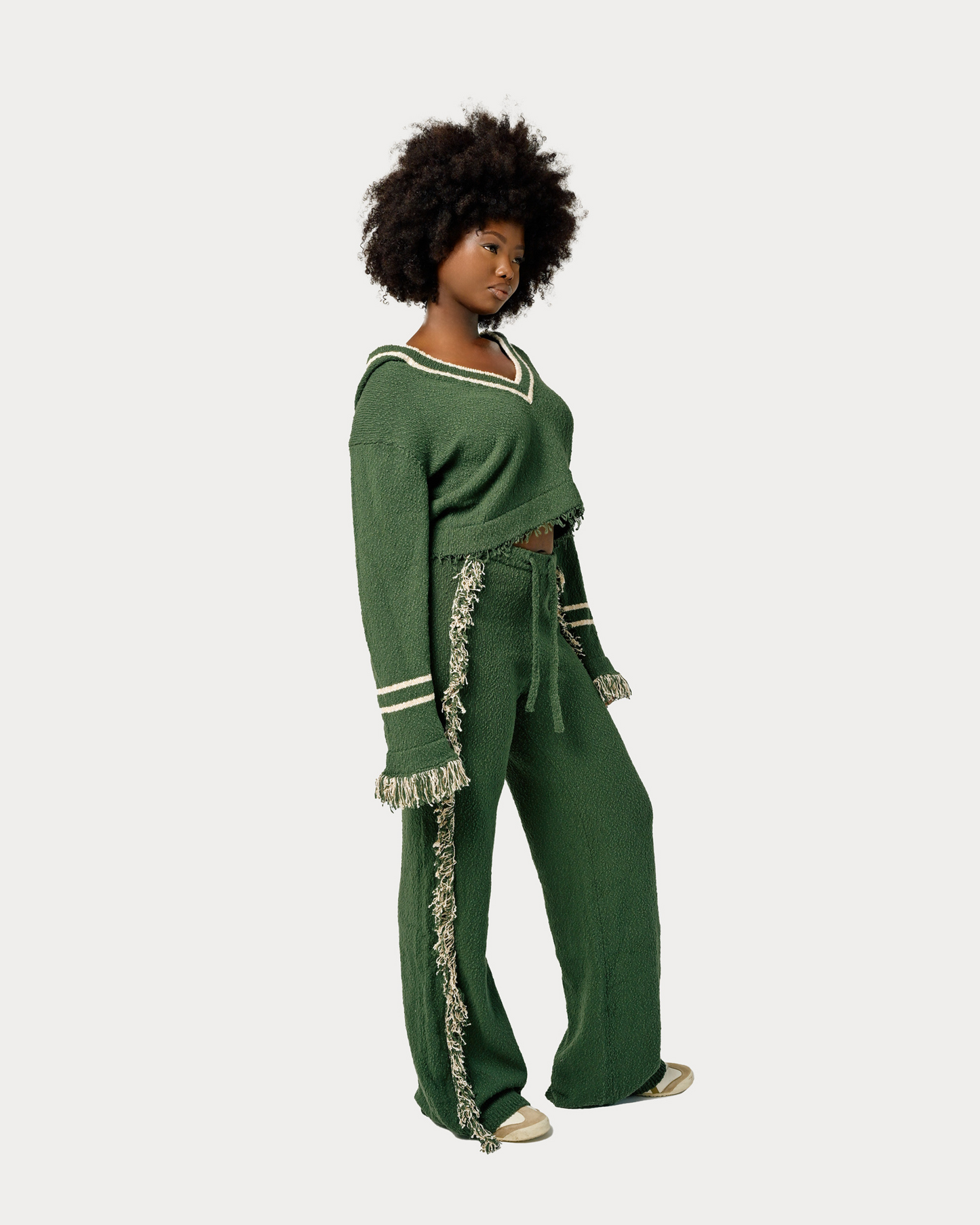Model is wearing size M in Andy Knit Fringe Hoodie in Green. Matching separate is available for full knit look.