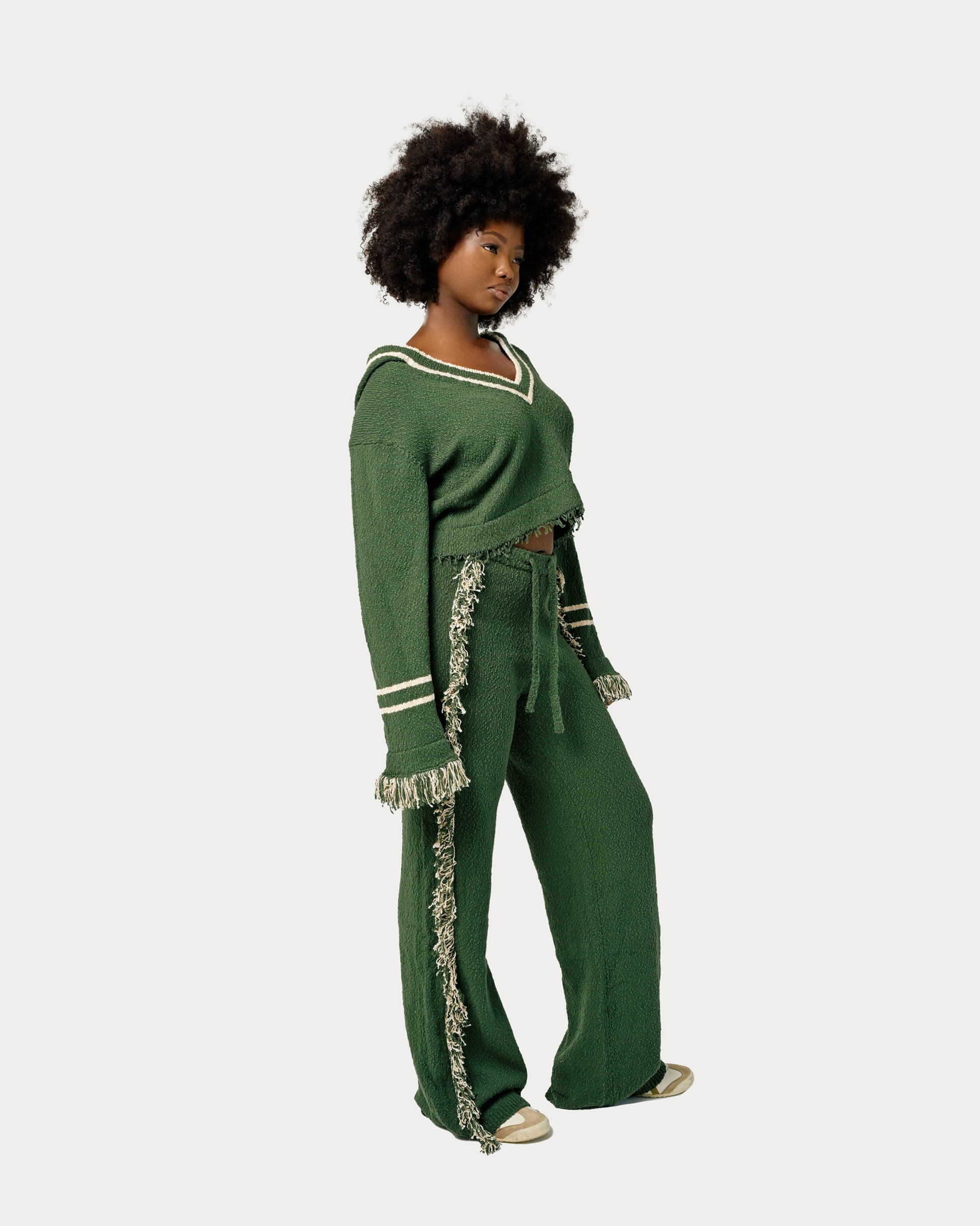 Model is wearing size M in Andy Knit Fringe Hoodie in Green. Matching separate is available for full knit look.