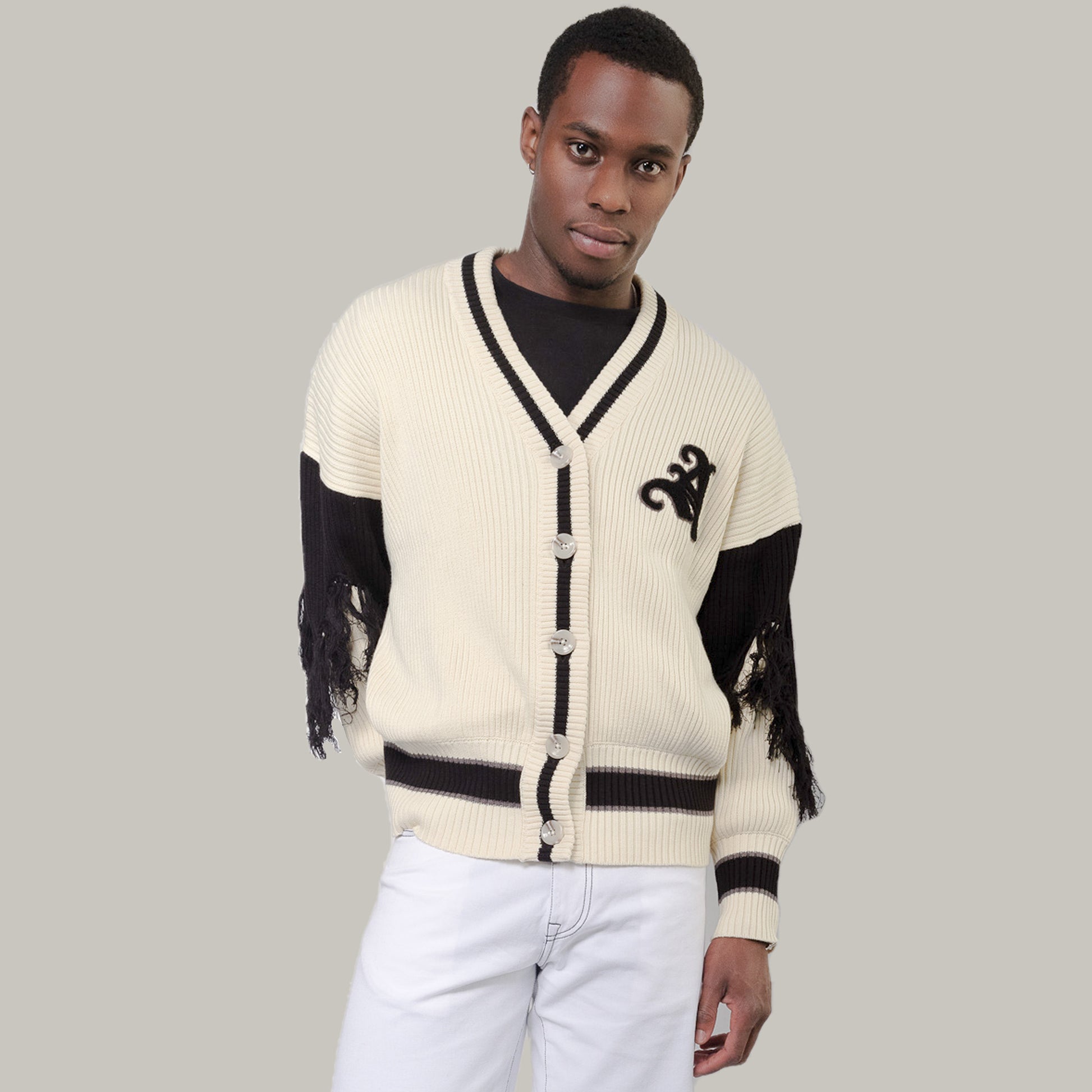 Male Model wearing Varsity Cardigan in Cream/Black wearing size Large/XLarge