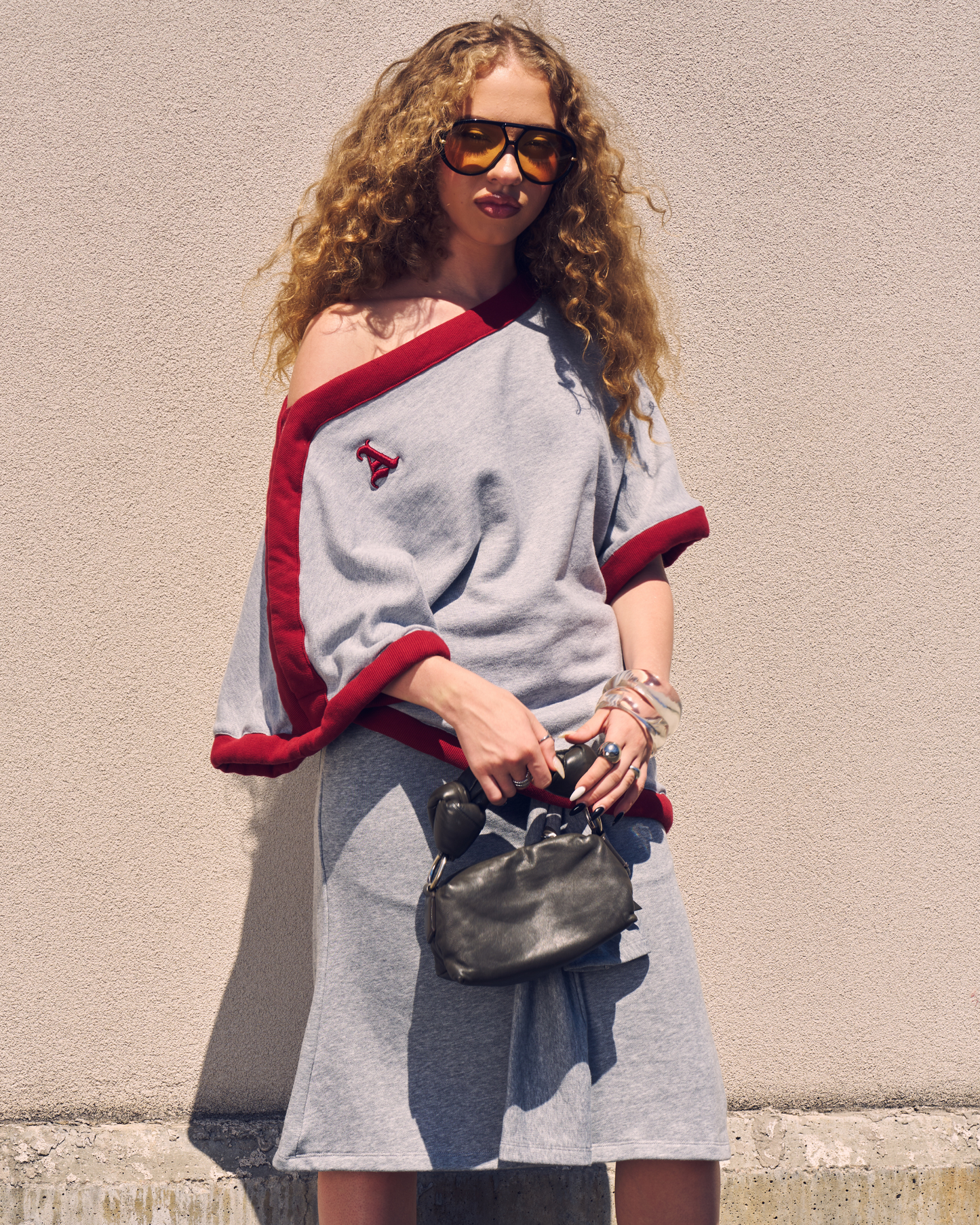Woman is wearing Jolie Draped Off-the-shoulder  Poncho Top by Aseye Studio in blended size S/M. Made in Italy