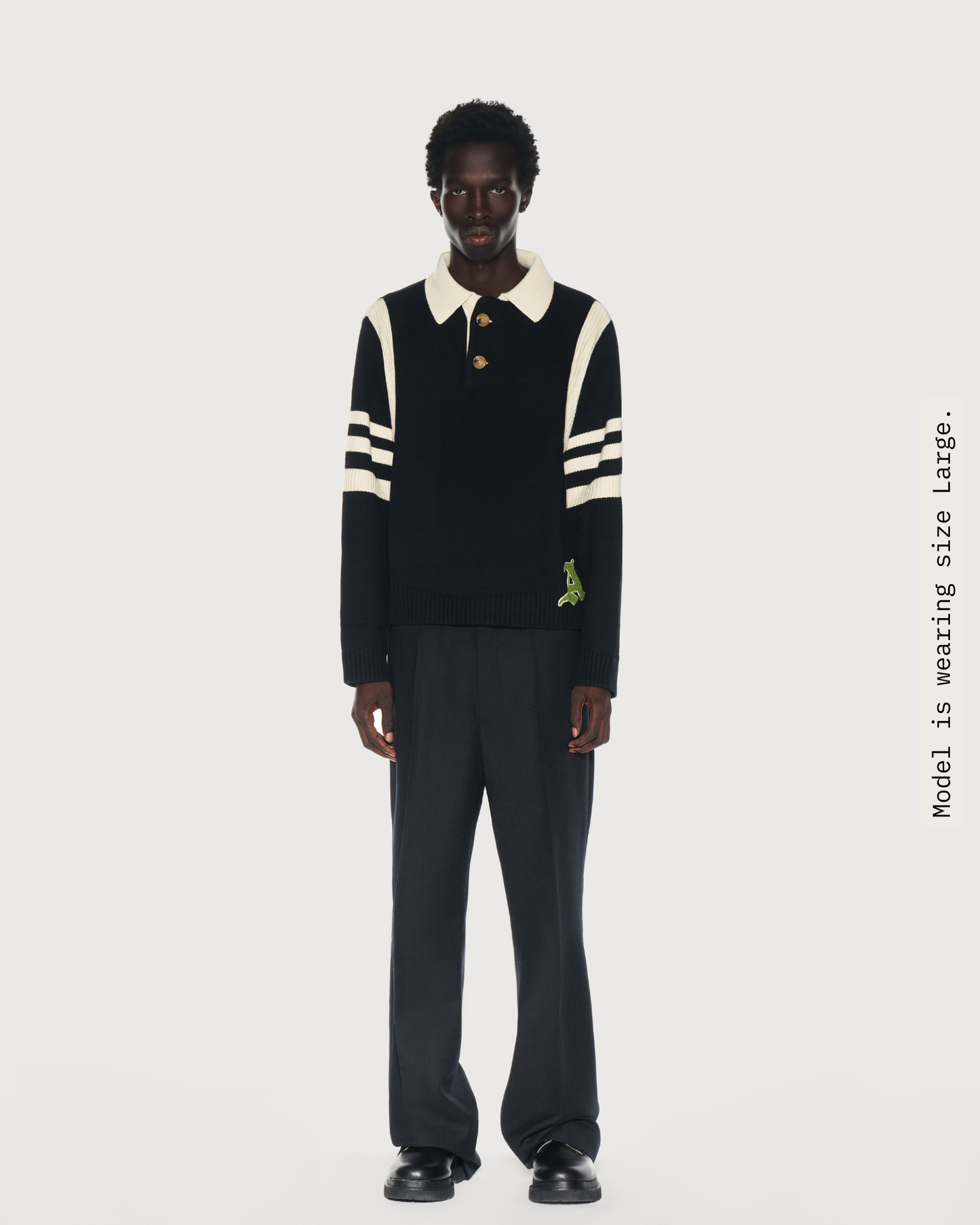 Model is wearing size Large in Kai Rugby Knit Sweater by Aseye Studio. 