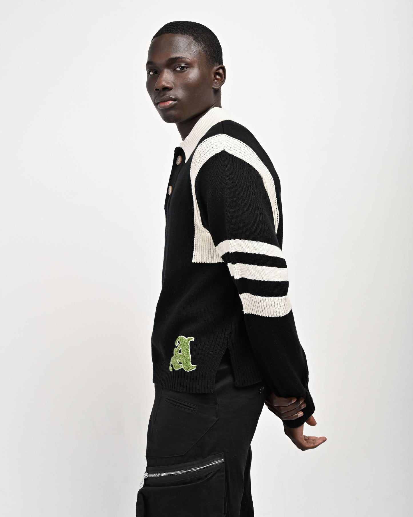 Model is wearing Kai Rugby Knit in Black by Aseye Studio