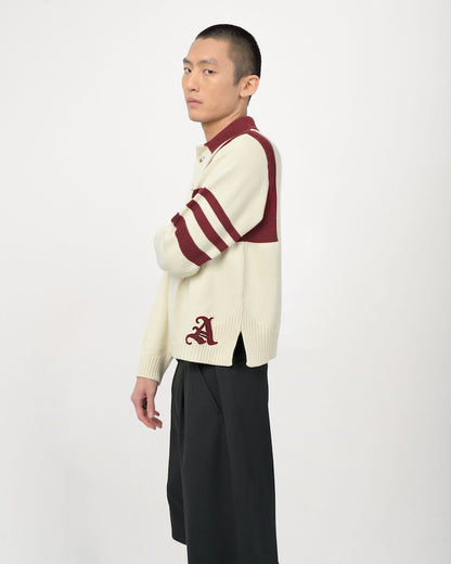 Model is wearing Kai Rugby Knit in Cream and Maroon