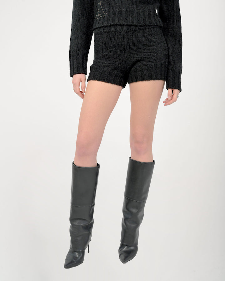 Model is wearing a size small in the Zaya Knit Shorts by Aseye Studio in black