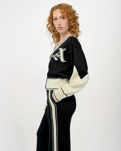 Model is wearing a size Small in the Byrd Classic Knit Cardigan in Black and Cream by Aseye Studio