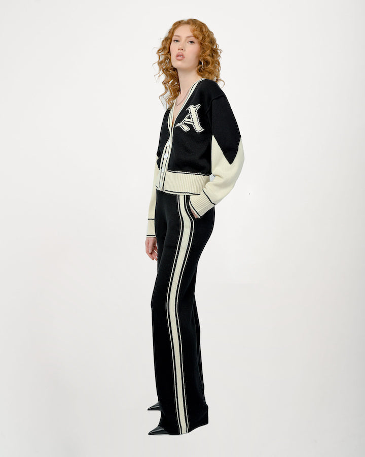 Model is wearing size Small in the Byrd Classic Knit Pants in black by Aseye Studio