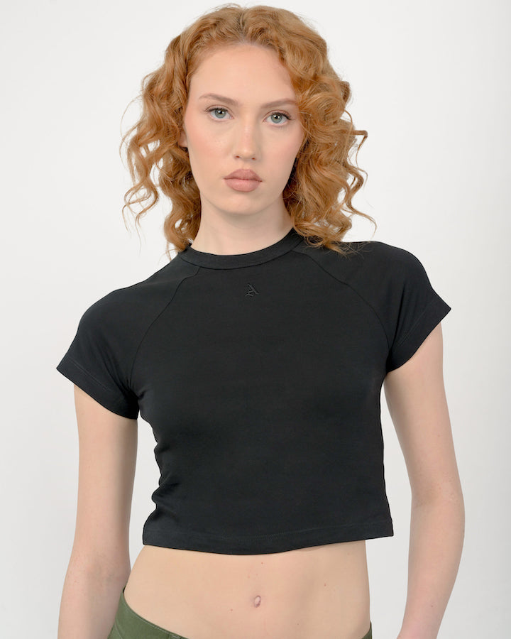 Model is wearing a size XSmall in our signature black Baby Tee for Women by Aseye Studio