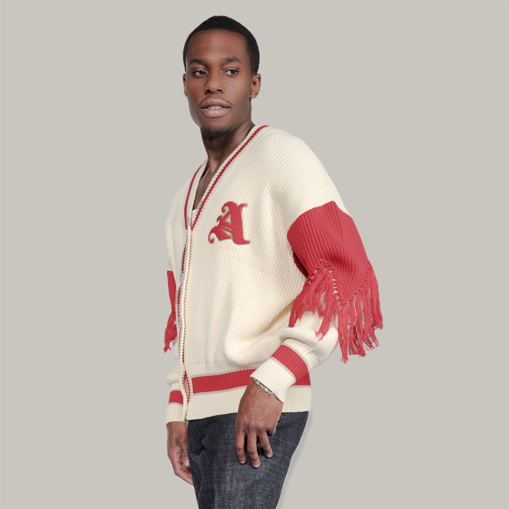 Male Model wearing size L/XL in the Varsity Cardigan by Aseye Studio in Cream and Red