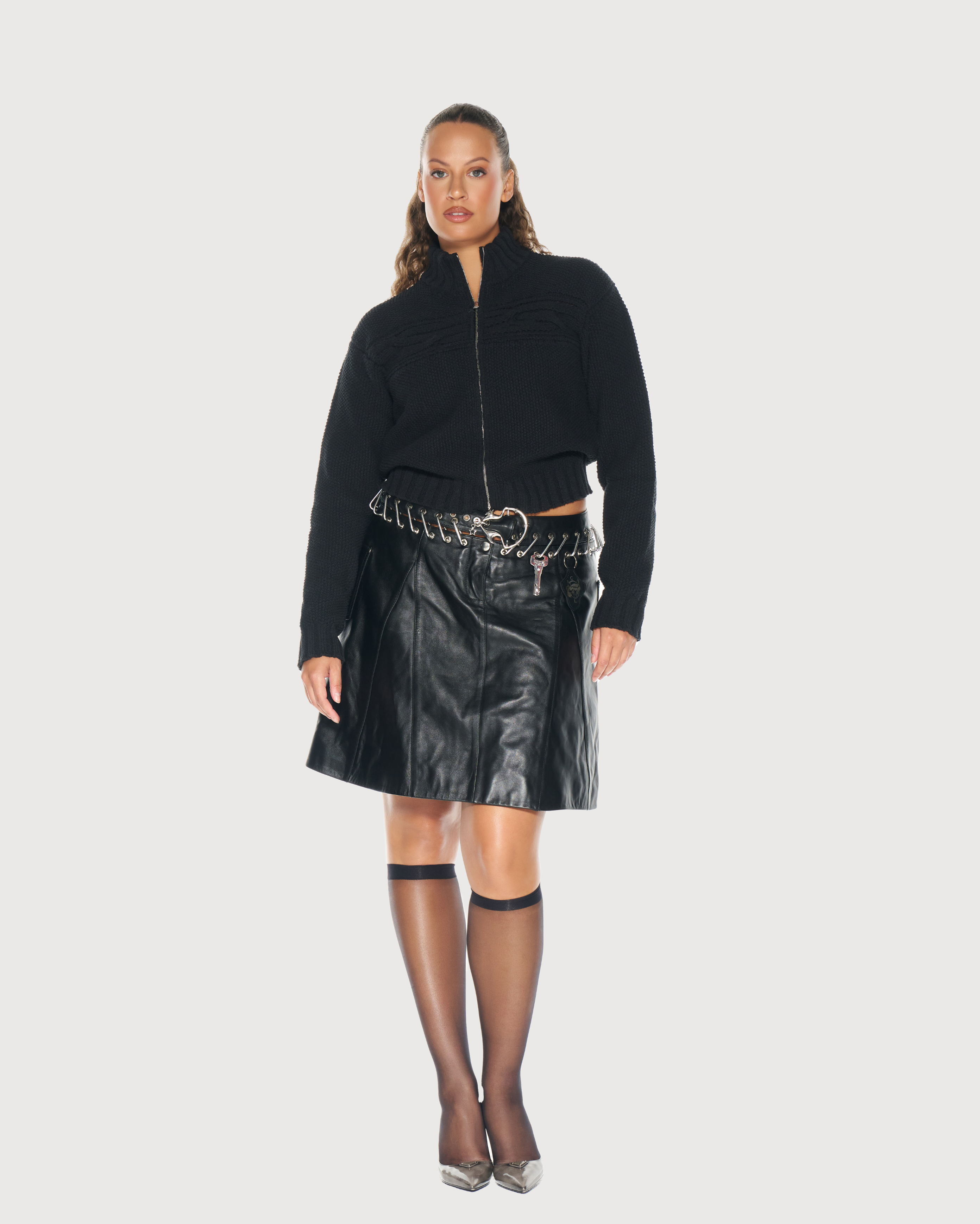 Woman is wearing elevated black zip-up knit sweater in size Large by Aseye Studio. Offer 35% Off for Black Friday Week and Cyber Monday Sale. 