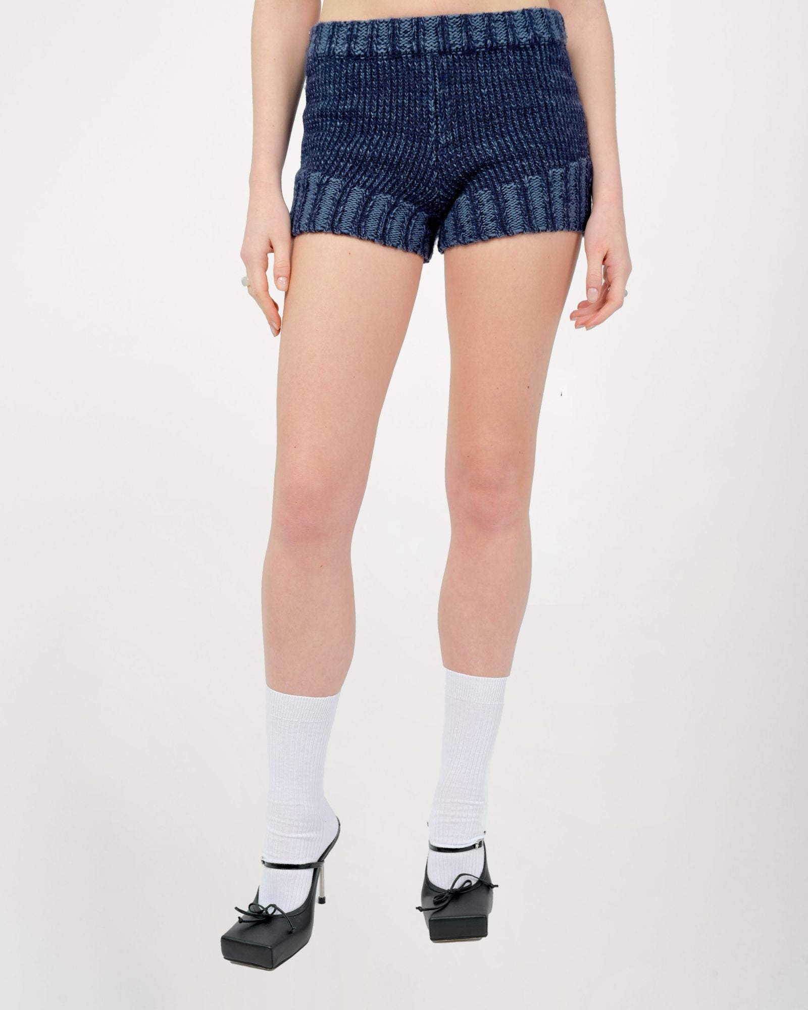 Model is wearing a size Small in Zaya Knit Shorts by Aseye Studio