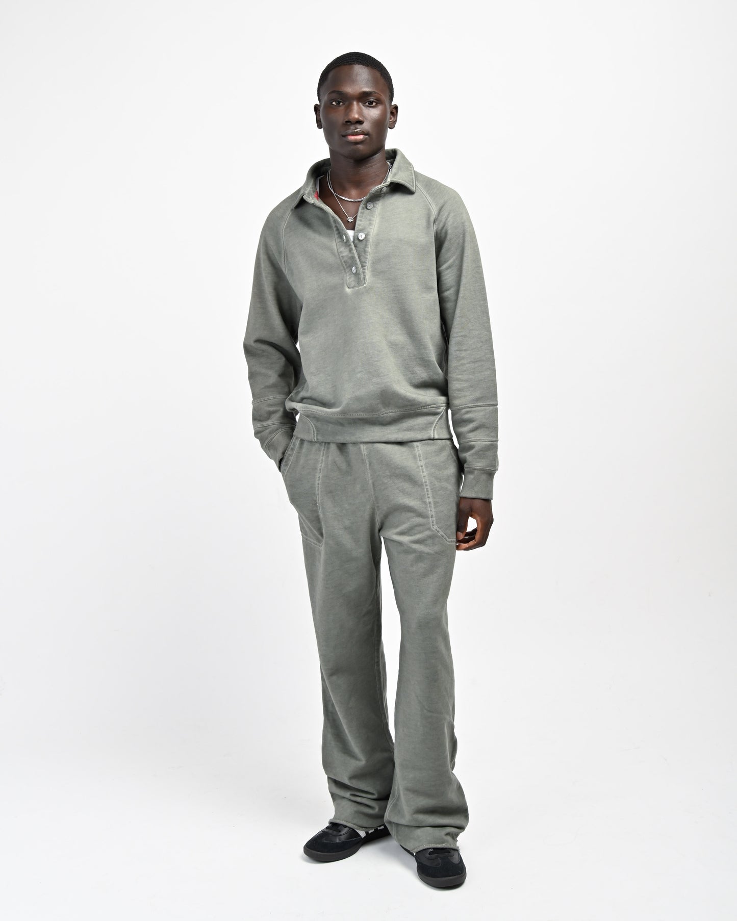 Model is wearing August Rugby Pullover Sweatshirt and Allora Track Pants by Aseye Studio