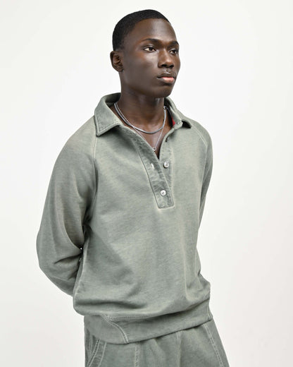 Model is wearing August Pullover Sweatshirt in Muted Green by Aseye Studio