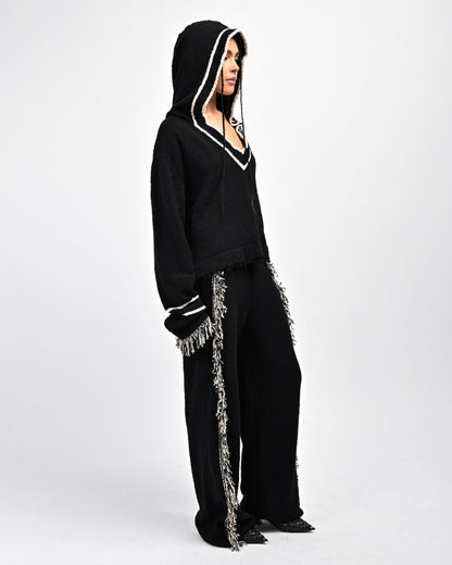 Side View of Model in Andy Fringe Knit Hoodie and Pants by Aseye Studio