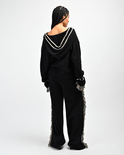 Back View of Model wearing Andy Fringe Knit Hoodie and Andy Fringe Knit Pants in Black by Aseye Studio