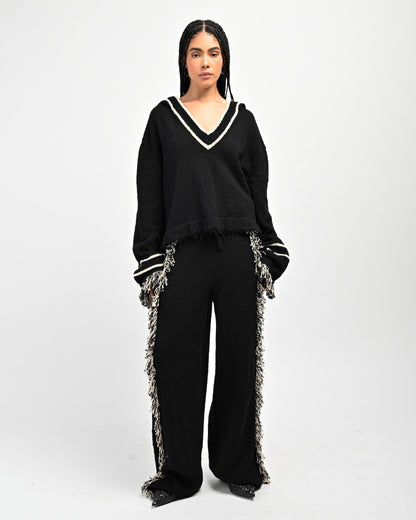 Model is wearing Andy Fringe Knit Hoodie and Andy Fringe Knit Pants by Aseye Studio