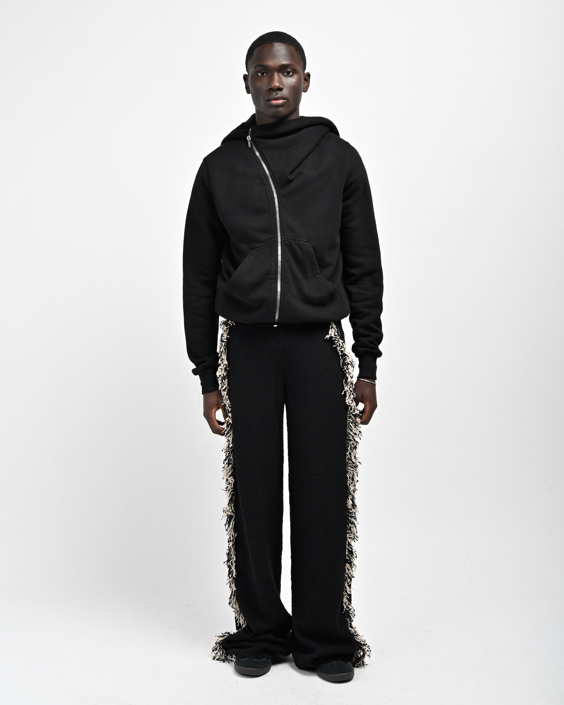 Model is wearing Andy Fringe Knit Pants by Aseye Studio