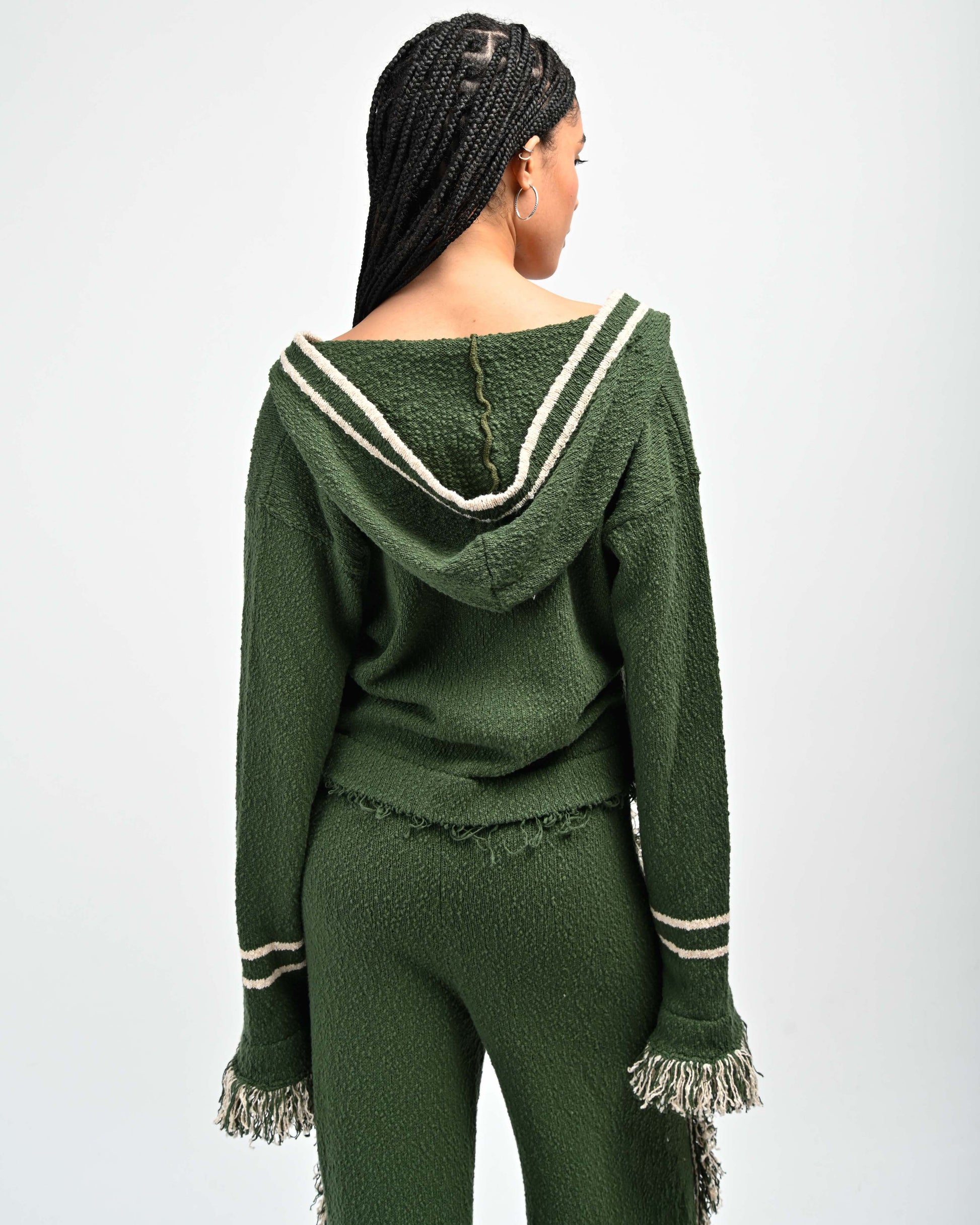 Back View of model in Andy Fringe Knit Hoodie in Green by Aseye Studio
