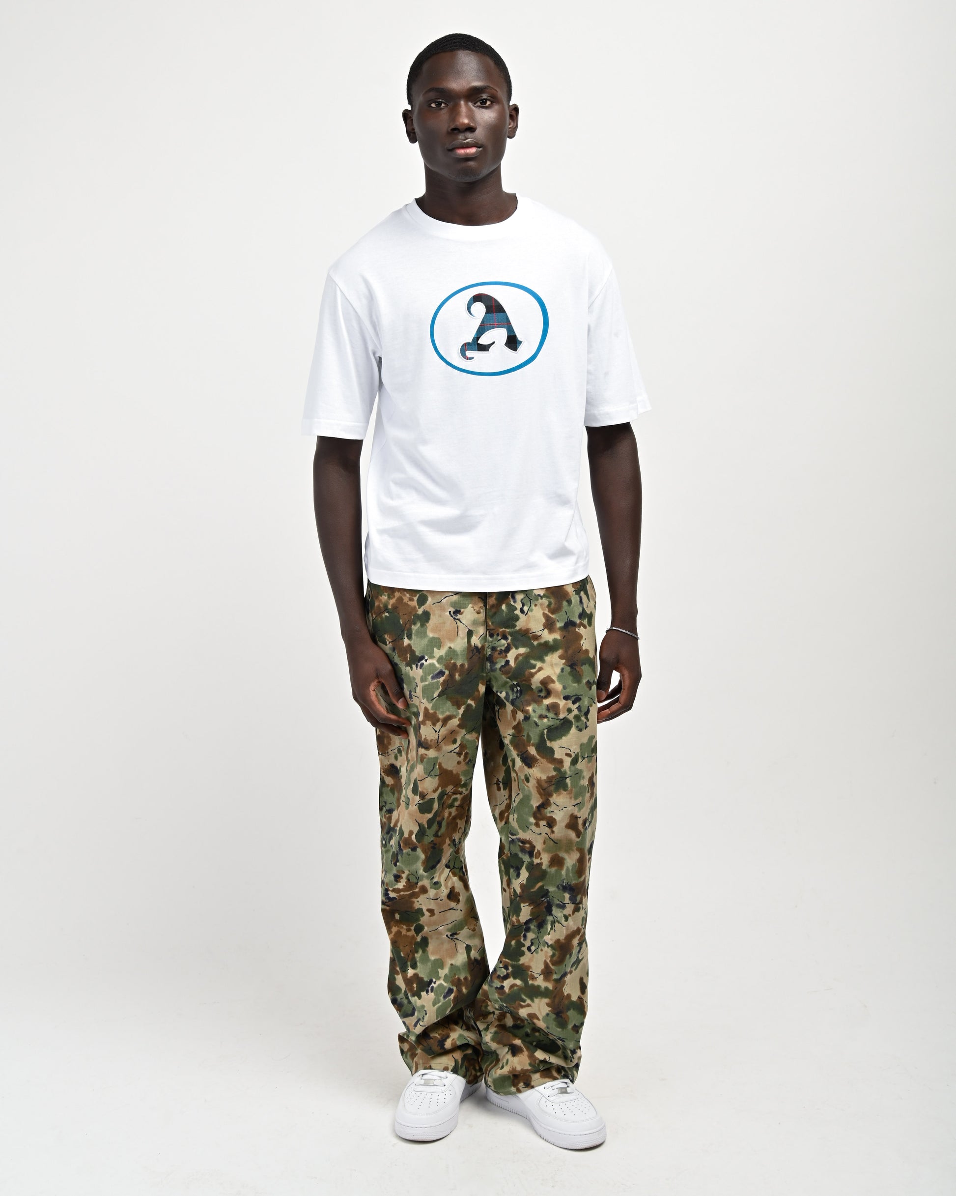 Model is wearing Plaid 'A' T-shirt by Aseye Studio