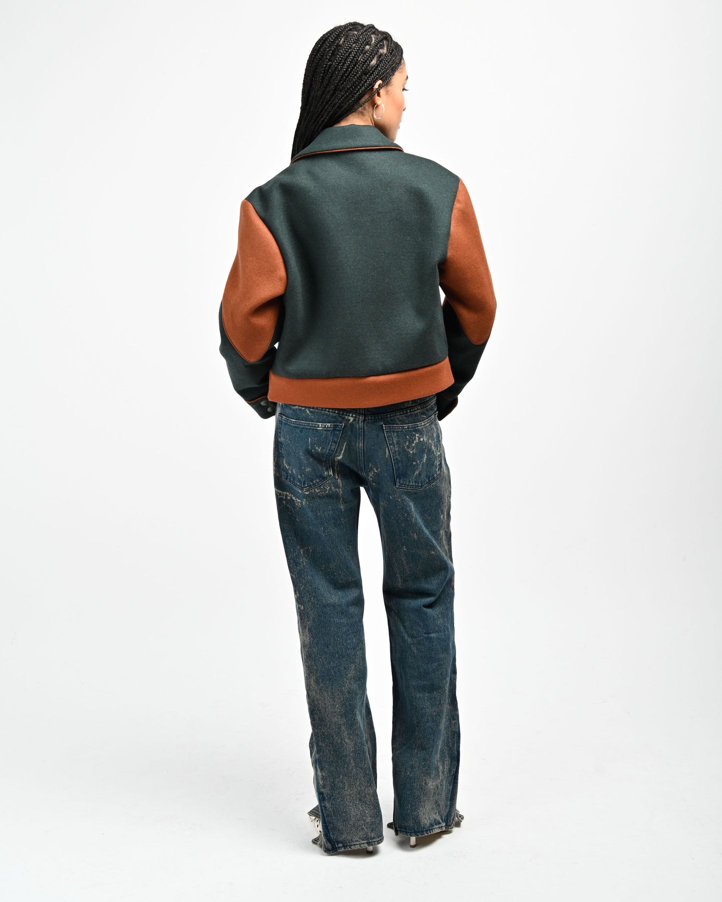 Back View of Model wearing Rue Varsity Jacket by Aseye Studio