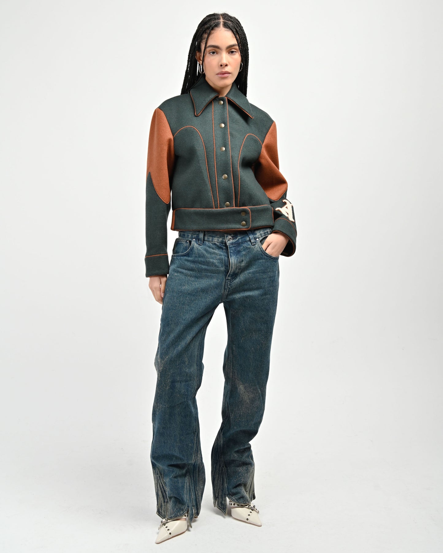 Model is wearing a size Small in Green Rue Varsity jacket by Aseye Studio