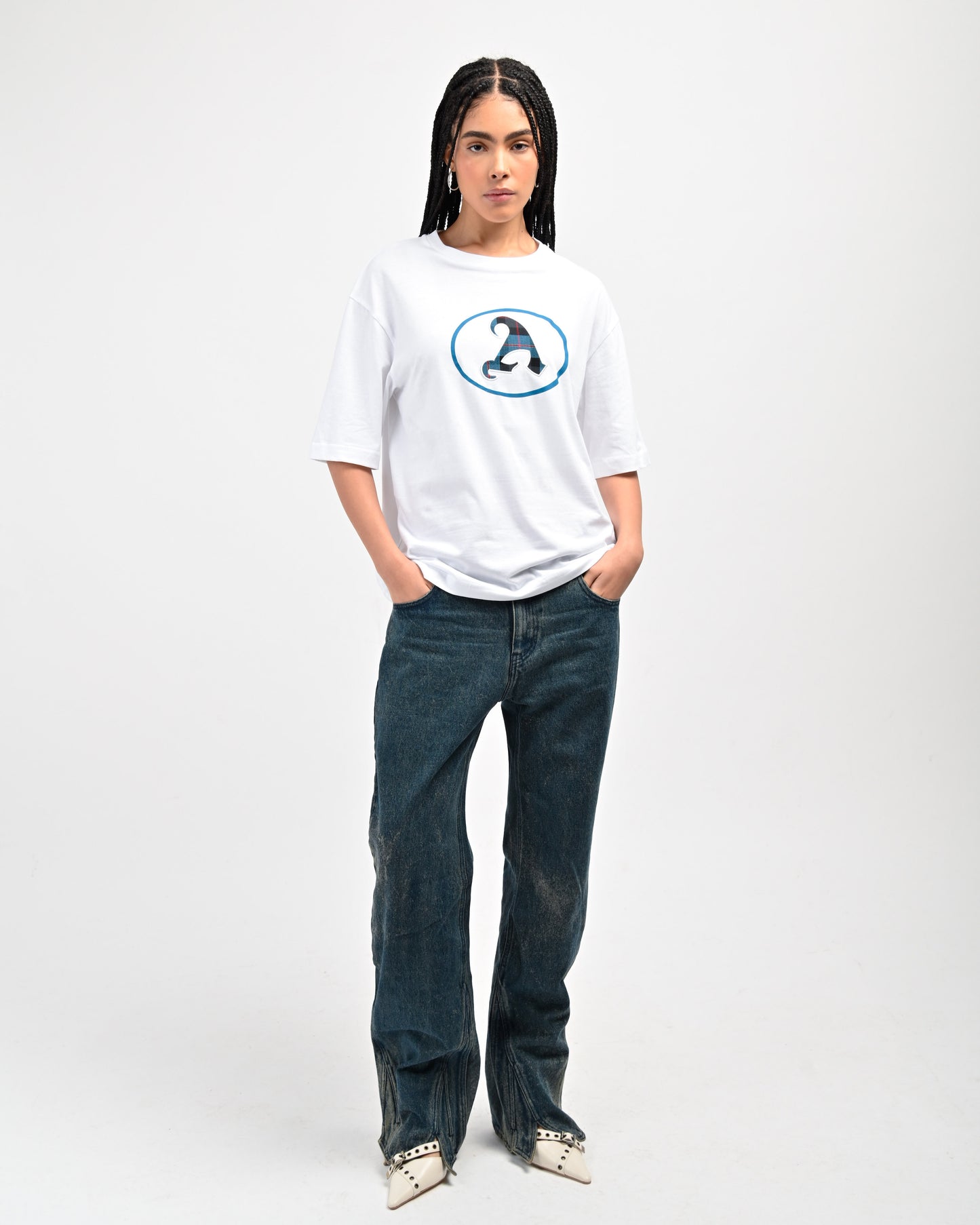 Model is wearing Plaid 'A' T-shirt in White by Aseye Studio