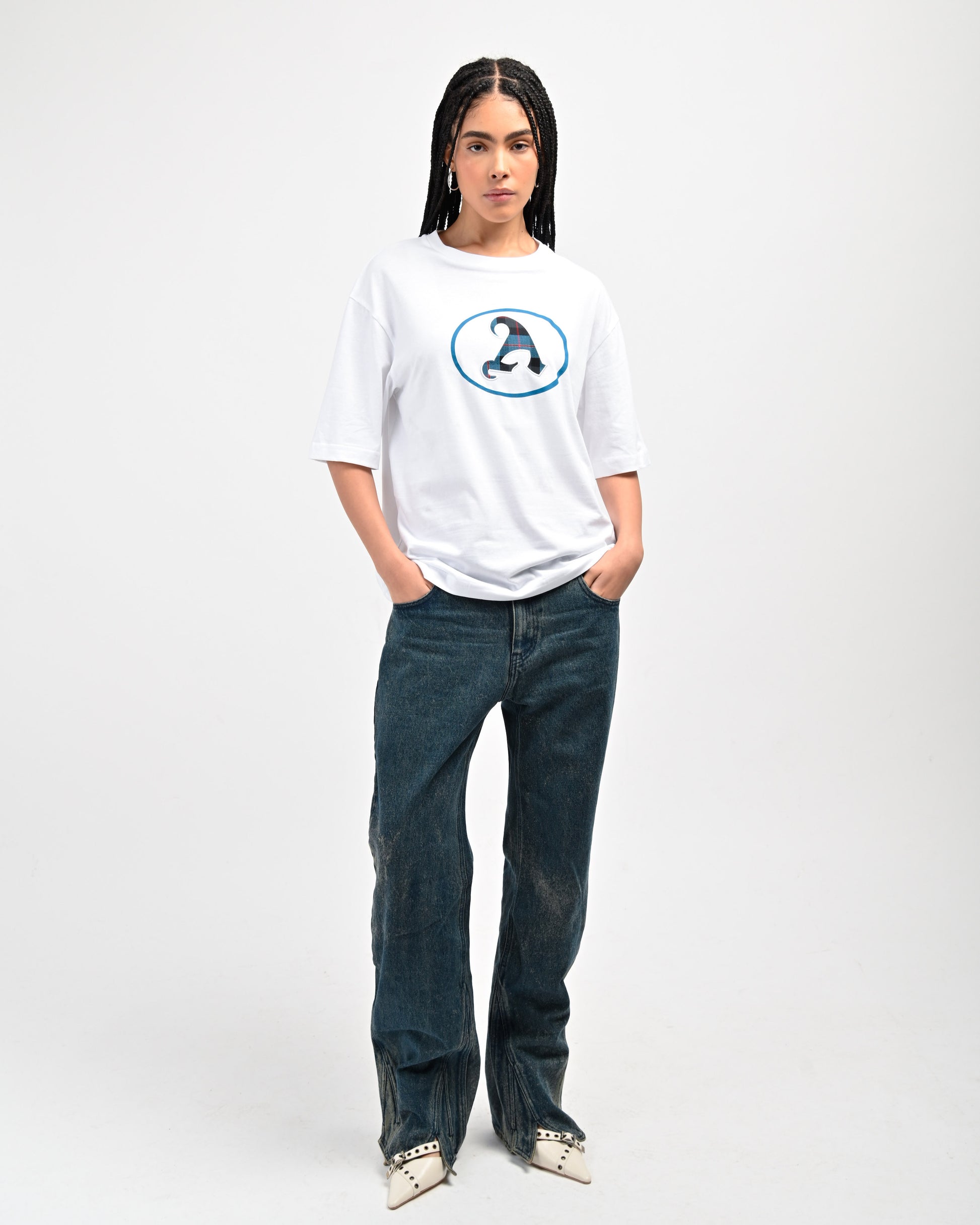 Model is wearing Plaid 'A' T-shirt in White by Aseye Studio