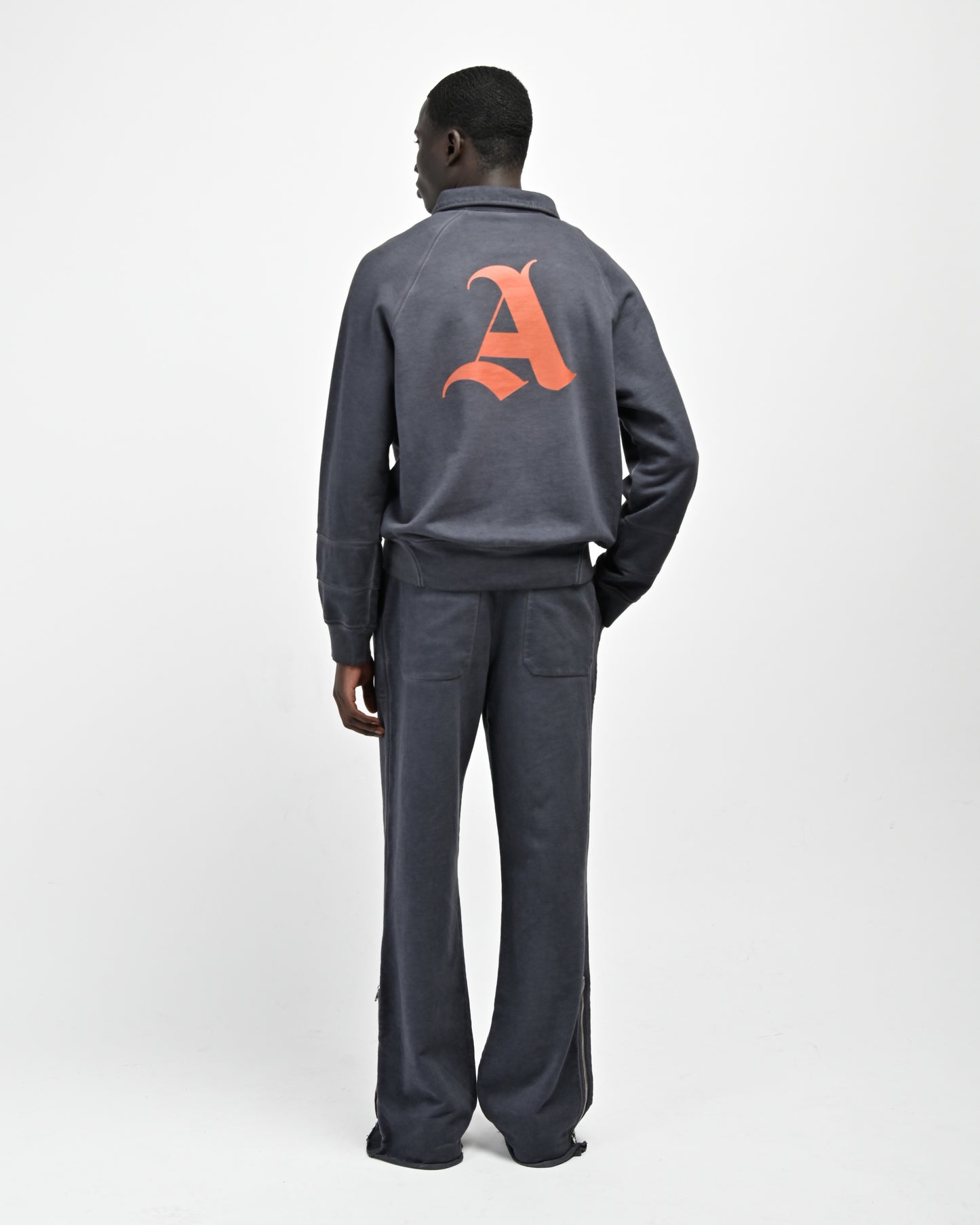 Back View of model wearing August Pullover Sweatshirt and Allora Track Pant by Aseye Studio