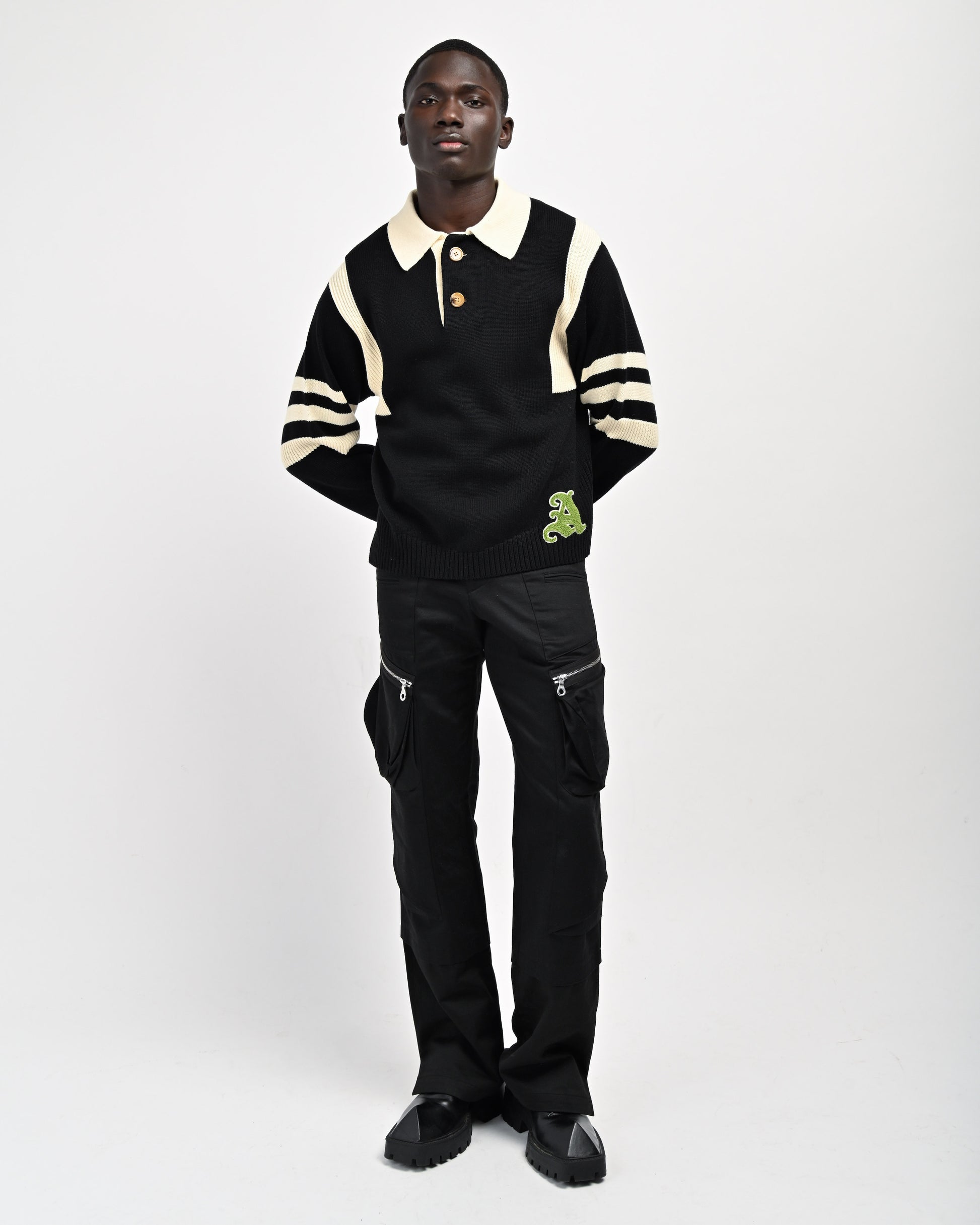 Model is wearing Kai Rugby Knit in Black by Aseye Studio