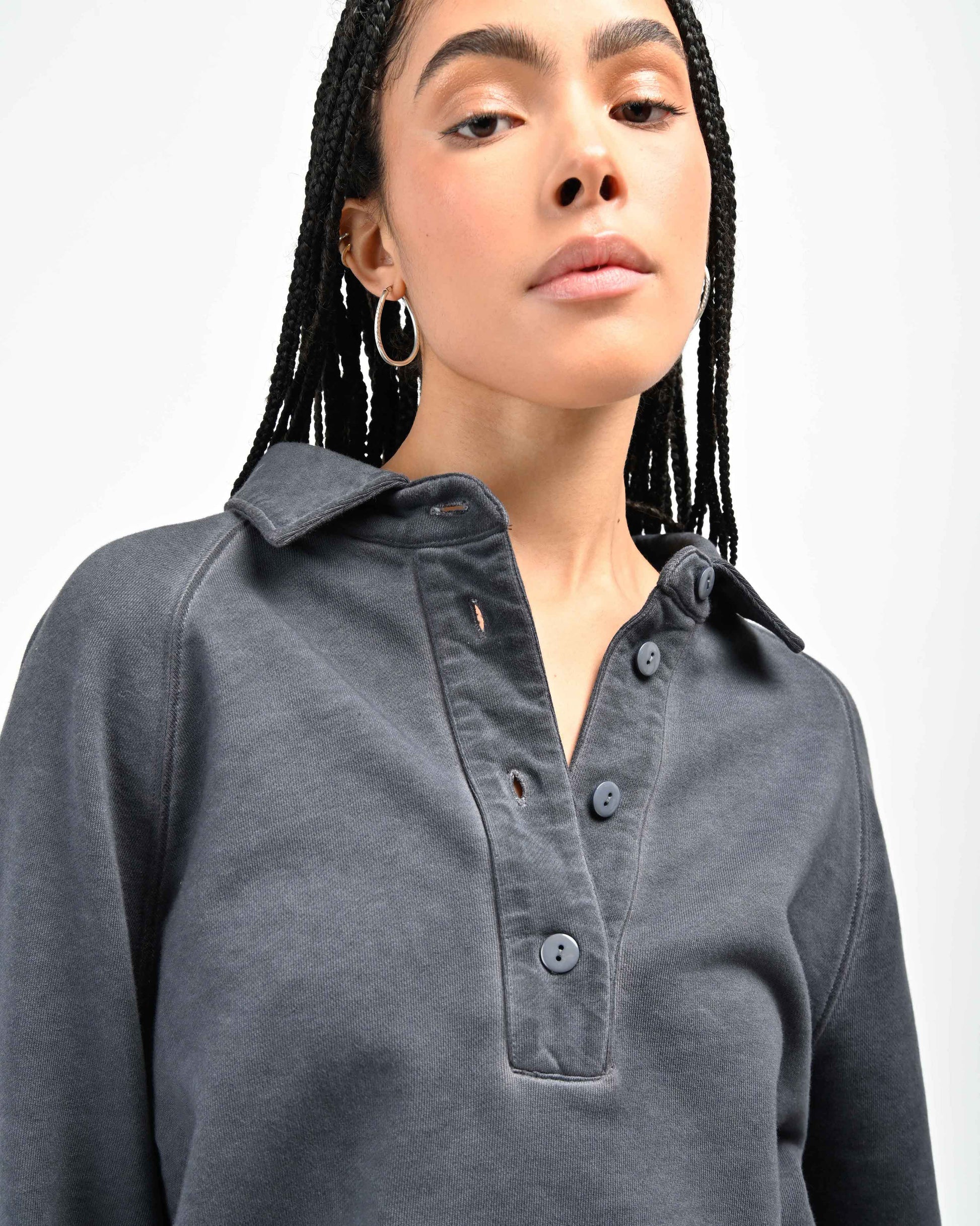 Detail View of Mother of Pearl Buttons on August Pullover Sweatshirt by Aseye Studio worn by model
