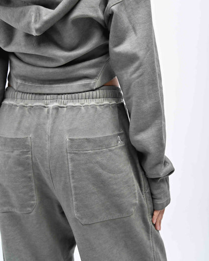 Detail view of model in Allora Track Pants by Aseye Studio