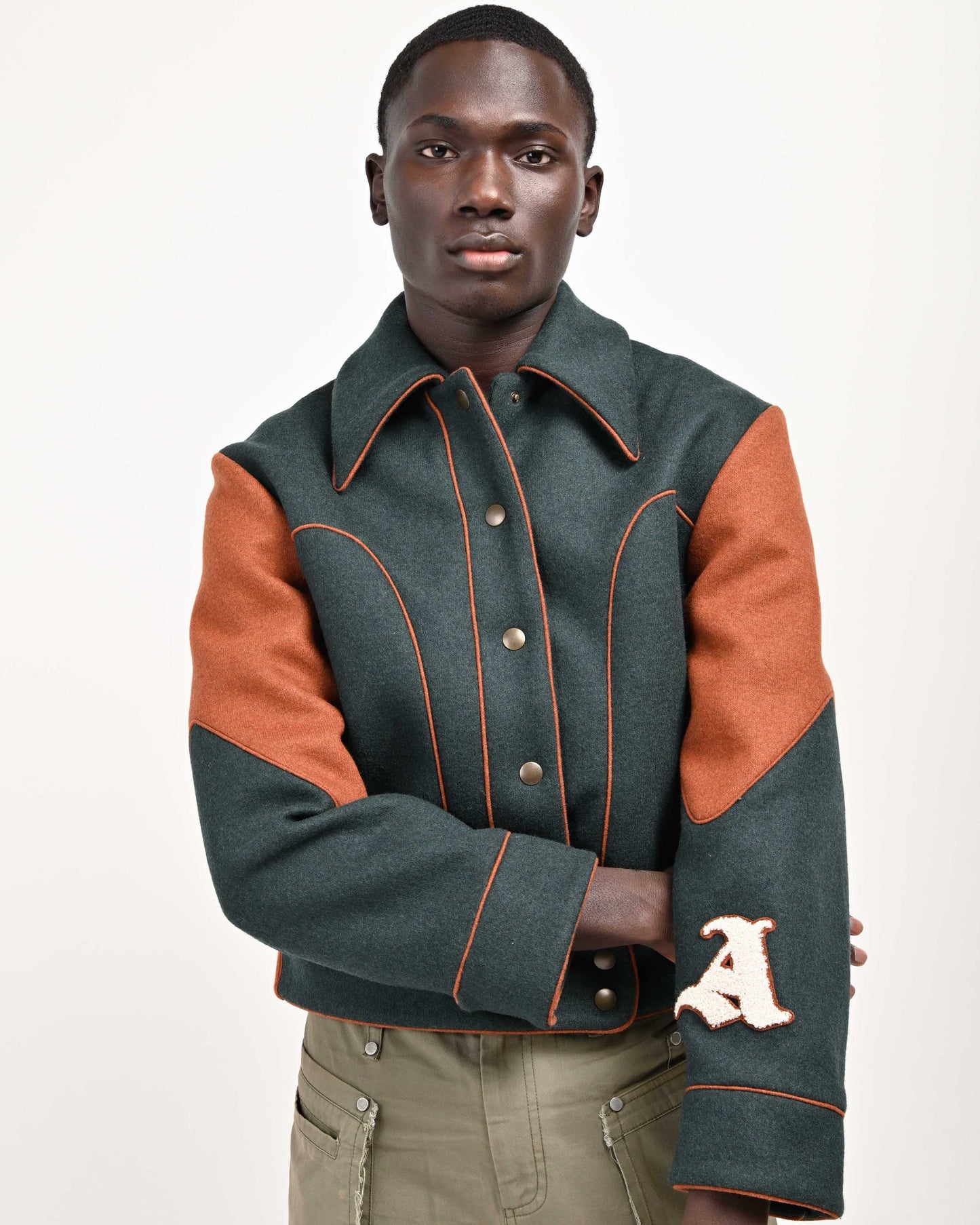 Closer View of Model wearing Green Rue Varsity Jacket by Aseye Studio