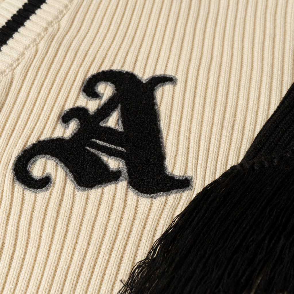 Detail View of Chenille Patch in Black and Grey Outline of Varsity Cardigan