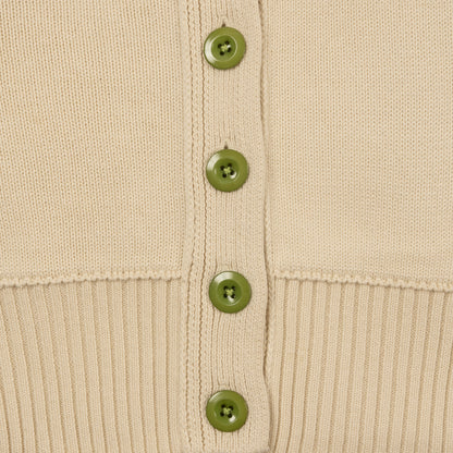 Detail Shot of Jade Green Buttons and Ribbed Hem on the Byrd Classic Cardigan in Cream
